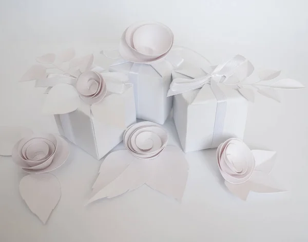 White gifts and white paper flowers — Stock Photo, Image