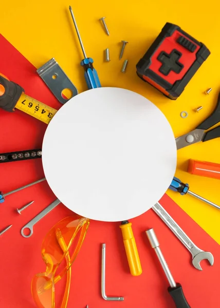 Top view of working tools, wrench, screwdriver, level, tape measure, bolts, and safety glasses. — Stock Photo, Image
