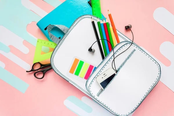 Creative school bag made of paper with school stationery. Close up.