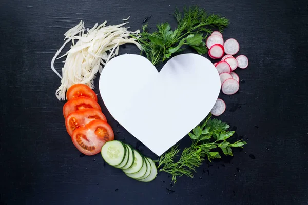 heart frame with fresh vegetables