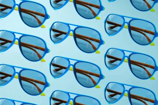 Sunglasses pattern on pastel blue background. Trendy concept — Stock Photo, Image