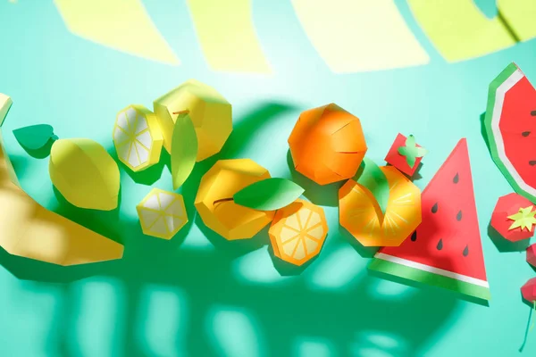 Different exotic fruits made of paper on trendy mint background — 图库照片