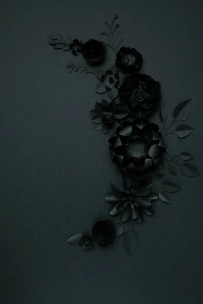 Black paper flowers on Black background. Cut from paper. Gothic frame. Total black. BLack friday concept.