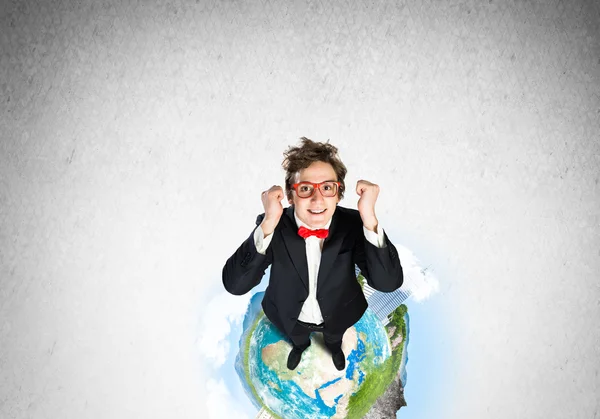 Businessman on Earth globe — Stock Photo, Image