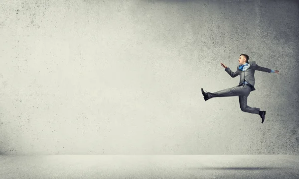 Businessman jumping high — Stock Photo, Image