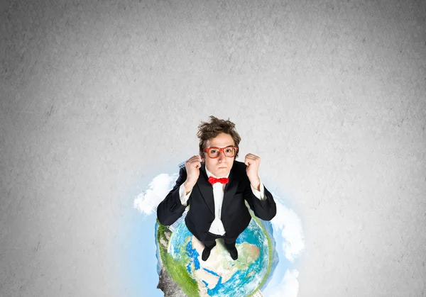 Businessman on Earth globe — Stock Photo, Image