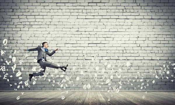 Businessman jumping high — Stock Photo, Image