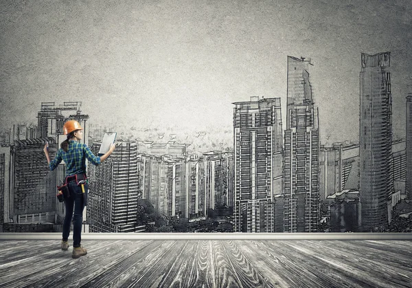 Woman with folder and sketches of construction project — Stock Photo, Image