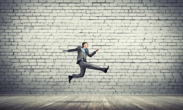 Businessman jumping high — Stock Photo, Image