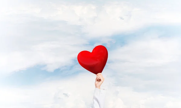 Doctor holding red heart — Stock Photo, Image