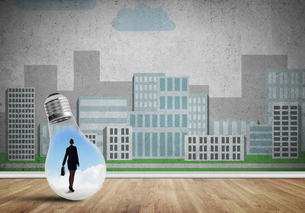 Businesswoman trapped in bulb — Stock Photo, Image