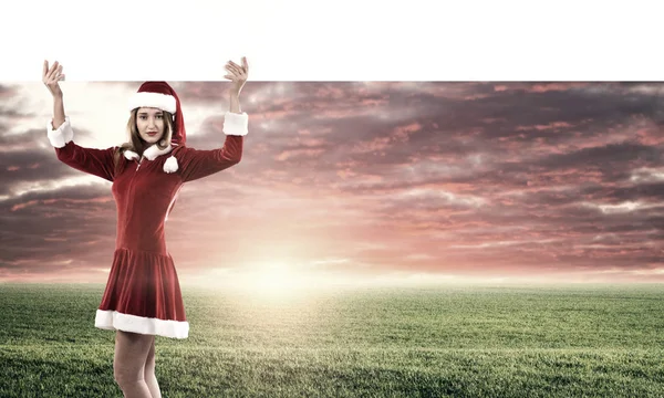 Christmas Santa girl with banner — Stock Photo, Image