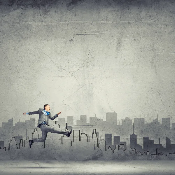 Businessman jumping high — Stock Photo, Image