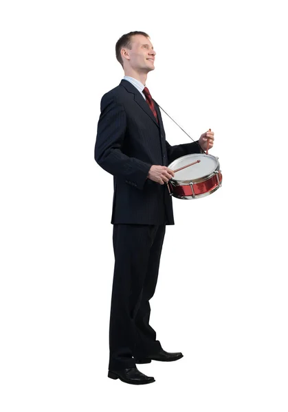 Бизнесмен играет на барабанах — стоковое фото