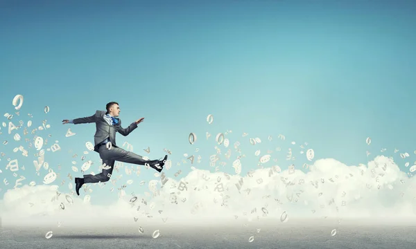 Businessman jumping high — Stock Photo, Image