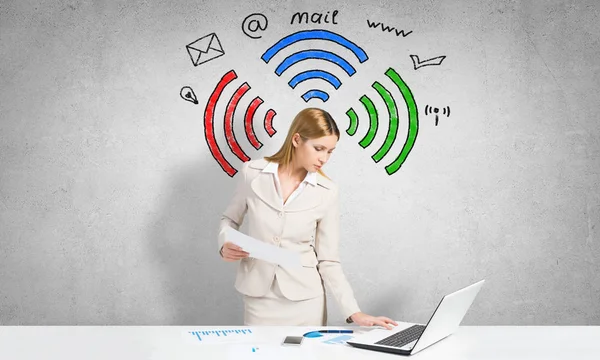 Attractive businesswoman using laptop — Stock Photo, Image