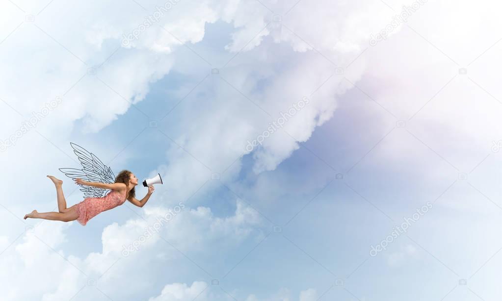 woman with megaphone flying 