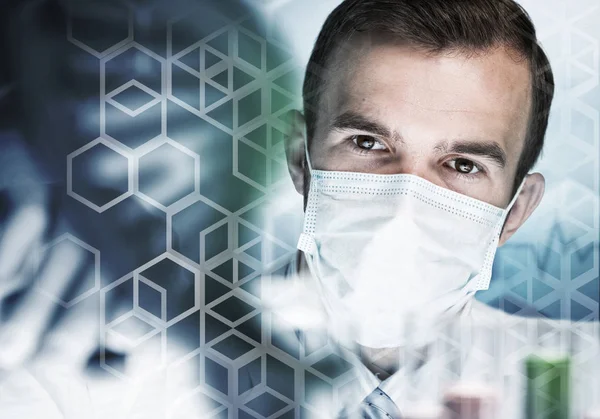 Portrait of concentrated male scientist working with reagents in — Stock Photo, Image