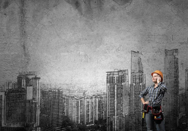 Ingeniera mujer en fondo de pared —  Fotos de Stock