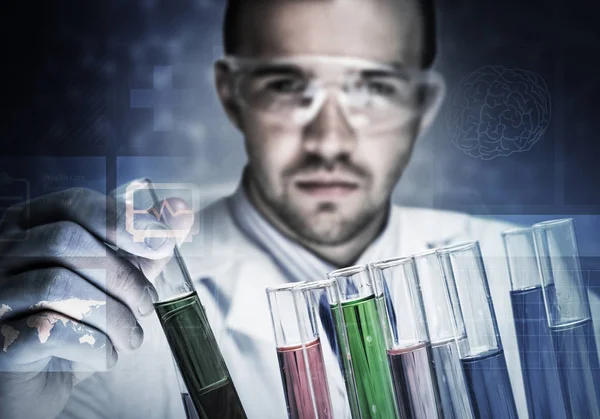 Portrait of concentrated male scientist working with reagents in Royalty Free Stock Images