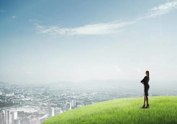 Businesswoman standing with back