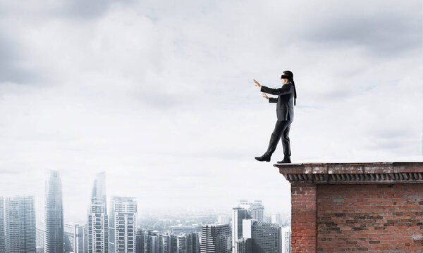 Businessman with blindfolder on eyes