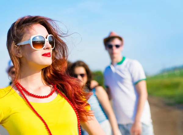 Stylish young woman in sunglasses — Stock Photo, Image