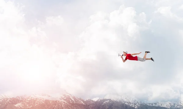 Young cheerful man with megaphone — Stock Photo, Image