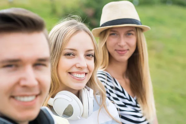 Young people sitting on staircase — Stock Photo, Image