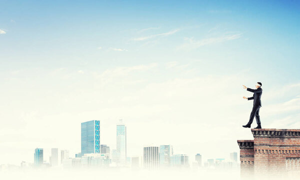 Businessman with blindfolder on eyes