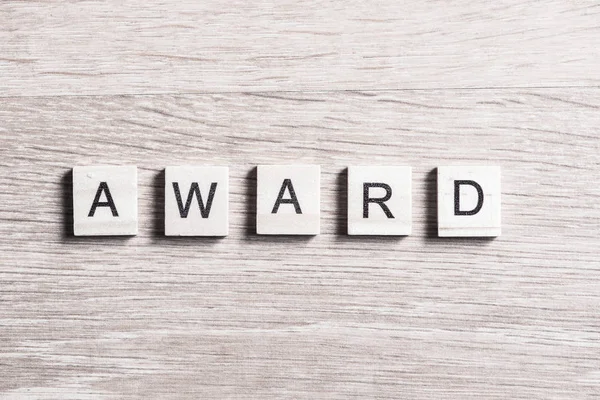 Award word on wooden table — Stock Photo, Image