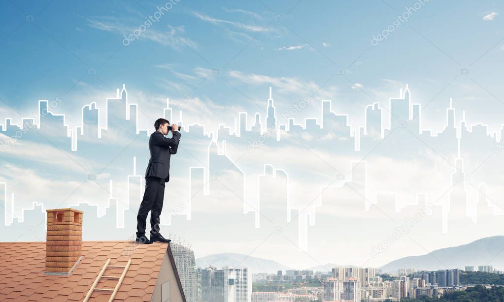 Young businessman viewing cityscape