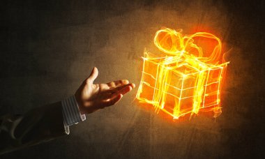  hediye kutusu simgesini avuç içi koyu arka plan