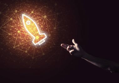 Roket parlayan simgesi ve işadamı el