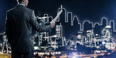 Arkadan görünüş işadamı modern cityscape karşı 