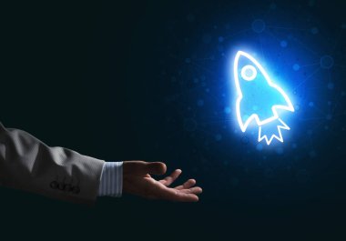 Roket parlayan simgesi ve işadamı el