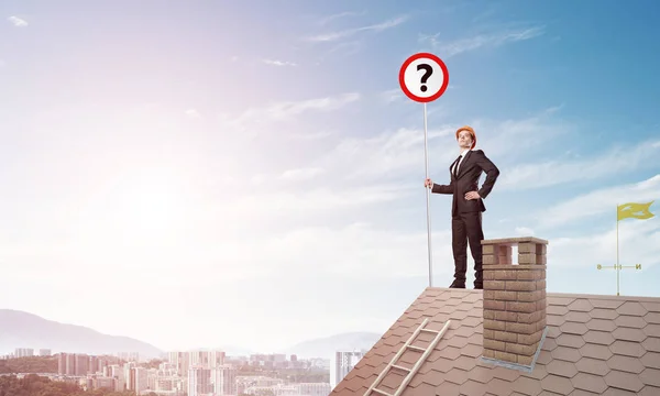 Businessman on house top — Stock Photo, Image