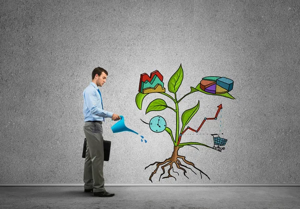 Businessman watering drawn growth concept — Stock Photo, Image