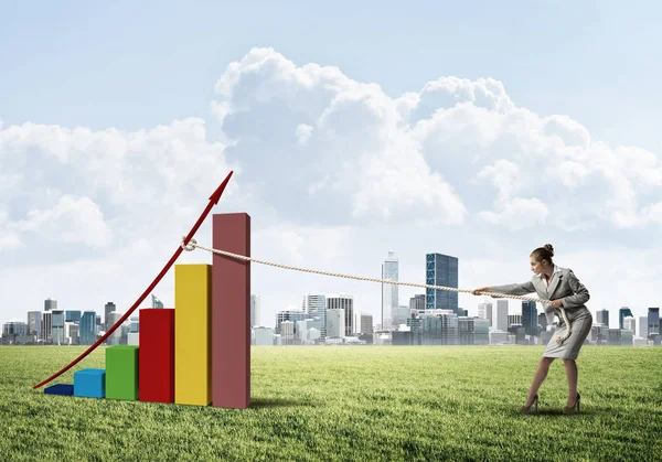 stock image Businesswoman pulling graph 