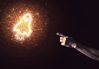 Roket parlayan simgesi ve işadamı el