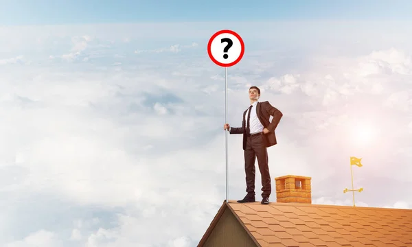 Businessman on house top — Stock Photo, Image