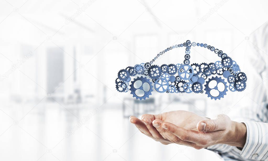 Male hands presenting concept of car