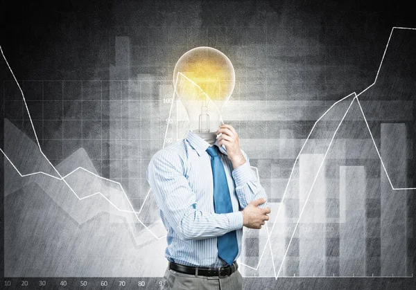 Pensive businessman with lamp head — Stock Photo, Image