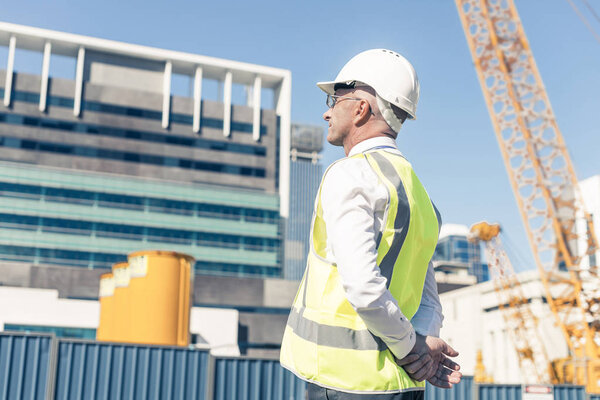 Engineer man in helmet and jacket 