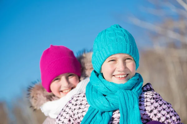 Cute girls riding at wintertime — Stock Photo, Image
