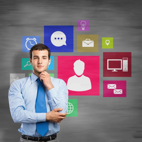 Young thoughtful businessman and colorful signs — Stock Photo, Image