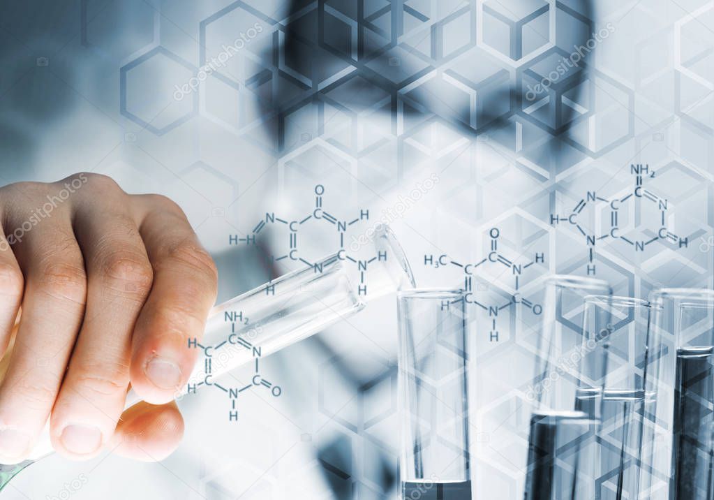 Young scientist mixing reagents