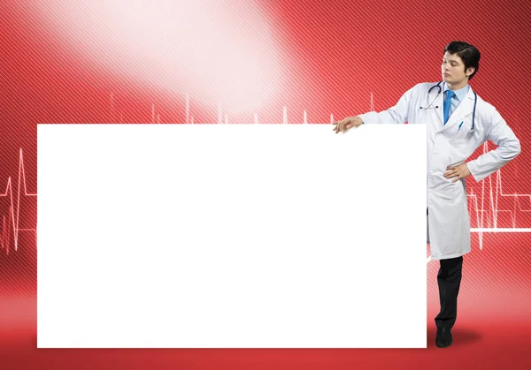 Doutor com banner branco em branco — Fotografia de Stock