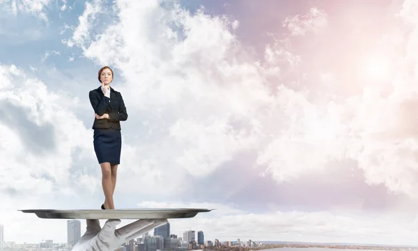 Businesswoman standing on tray — Stock Photo, Image