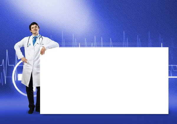 Doctor with white blank banner — Stock Photo, Image